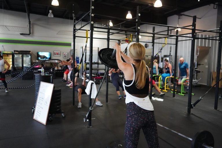 Barbell deadlift exercise with proper form in gym