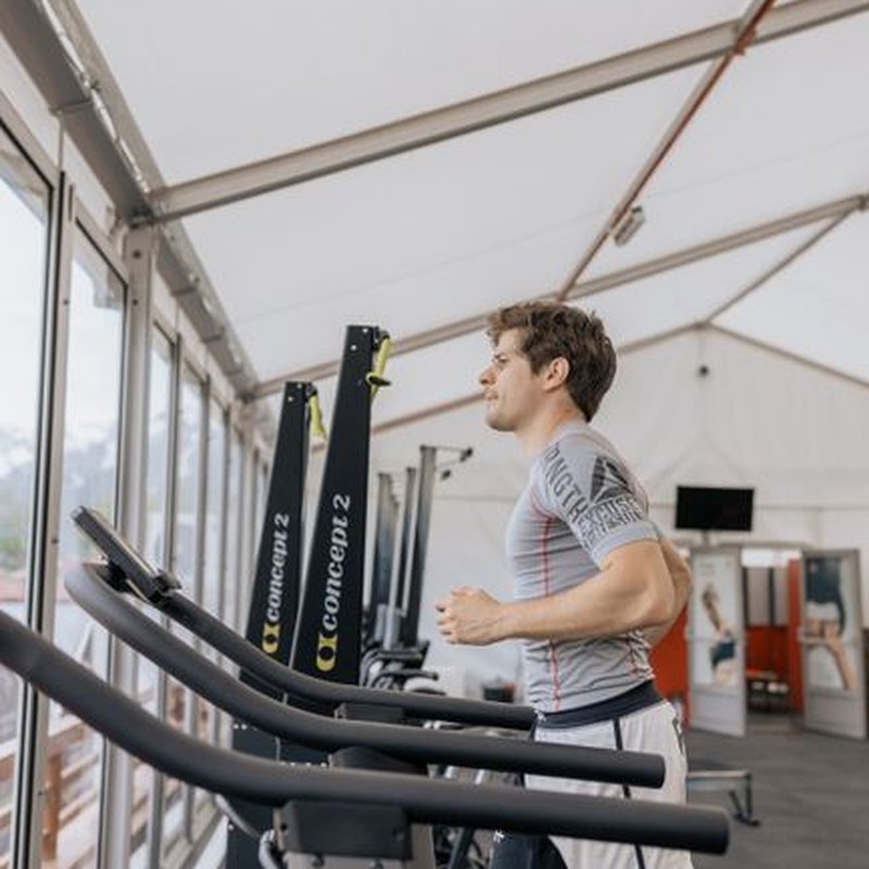 Man exercising on treadmill in a modern indoor gym. Healthy lifestyle captured in action shot.