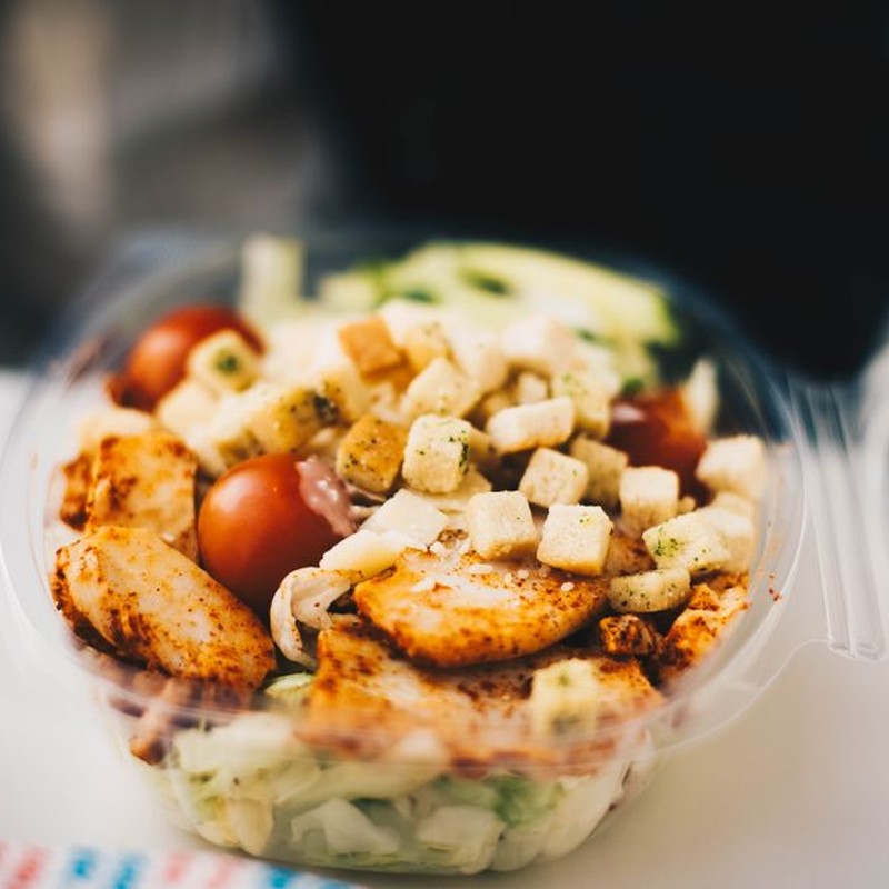 Delicious chicken salad with fresh greens and croutons, perfect for a healthy meal.