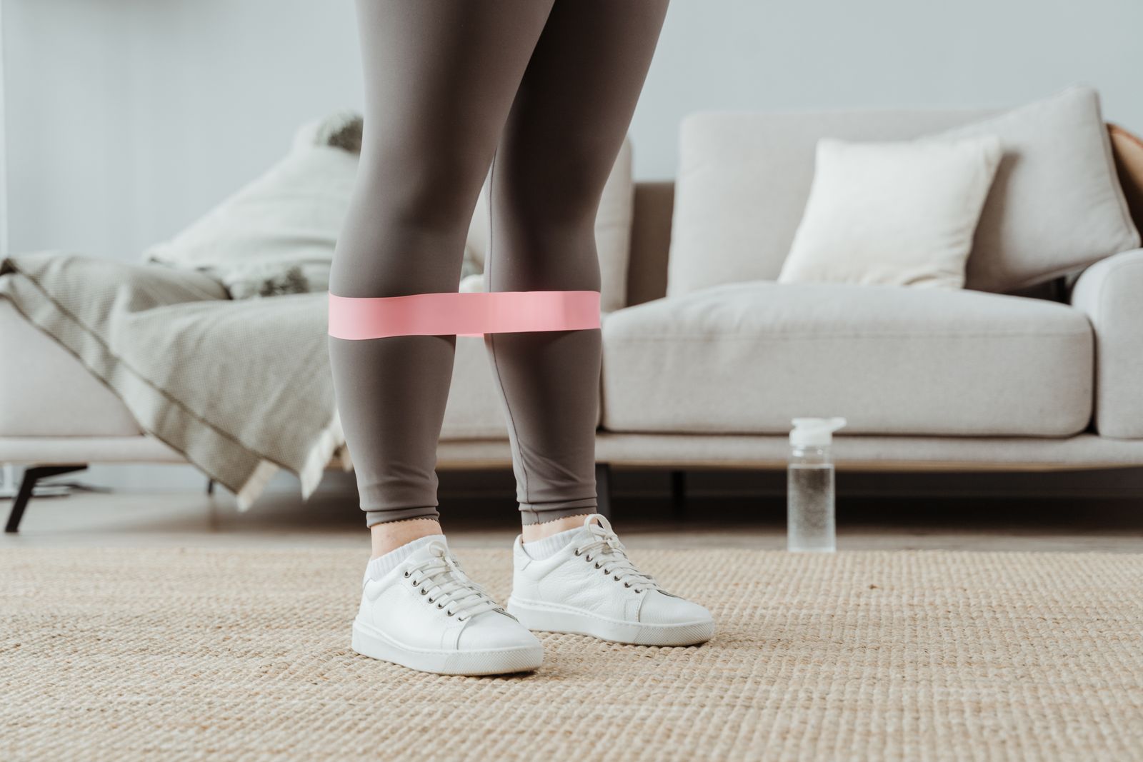 Person using a resistance band for leg rehabilitation exercises