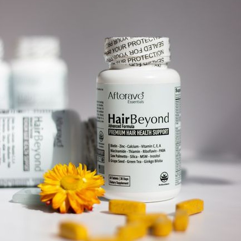 HairBeyond premium hair health supplement bottles with vitamins in focus.