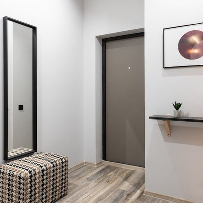 Interior of light hallway in minimalistic style placed in modern apartment in daytime