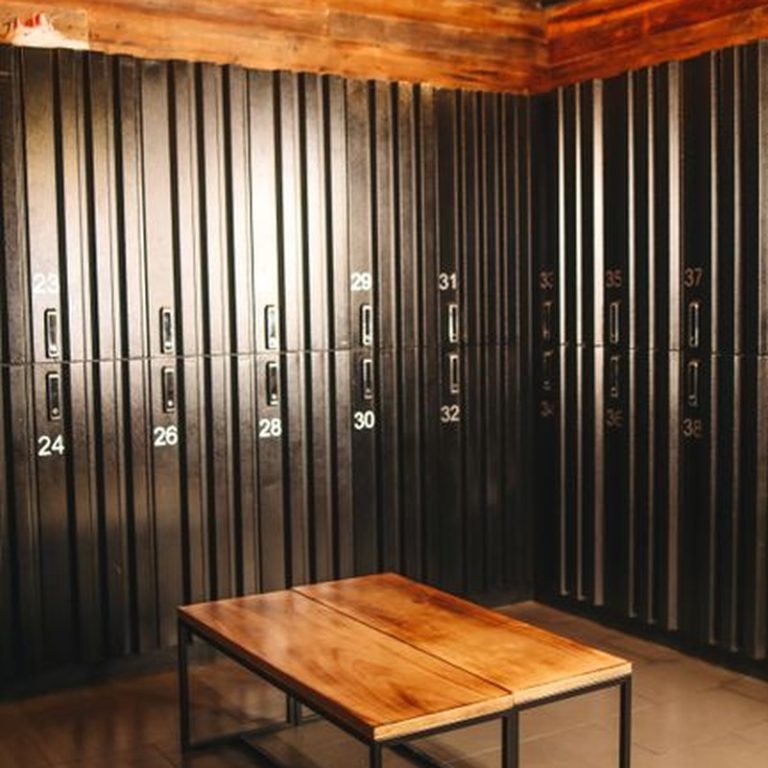 Cozy locker room with wooden accents and metal lockers in an industrial style setting.