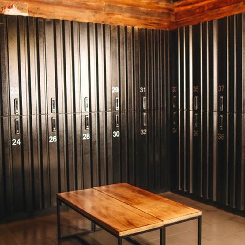 Cozy locker room with wooden accents and metal lockers in an industrial style setting.